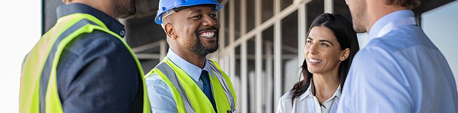 Construction Workers shaking hands with Business people